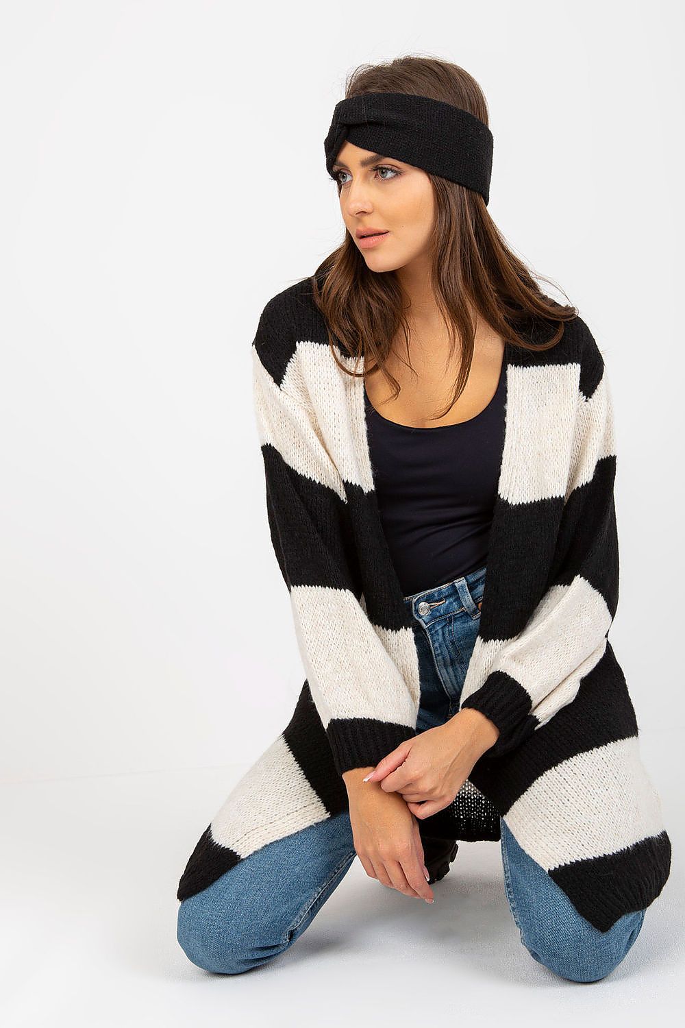 Och Bella Long Sleeve Cardigan with Colourful Stripes elegantly styled on a model, featuring classic black and white stripes with a loose fit, perfect for chic layering.