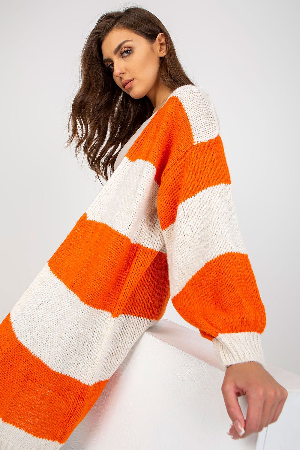 Close-up of the Och Bella Long Sleeve Cardigan with Colourful Stripes, highlighting the rich orange and cream knit design, offering a luxurious touch to casual wear.