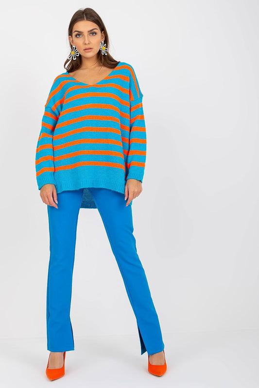 Och Bella Women's Colourful Striped Sweater with Long Sleeves and V-Neck Design, showcased in an elegant pose paired with striking orange heels and blue trousers, embodying a modern and fashionable aesthetic.