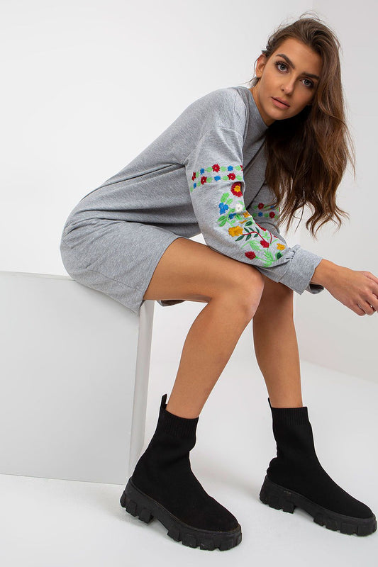 Stylish Long Sleeve Tracksuit Dress by Rue Paris with Embroidered Details, featuring a model showcasing a chic grey dress with decorative floral embroidery on the sleeves, perfect for a fashionable and comfortable look.