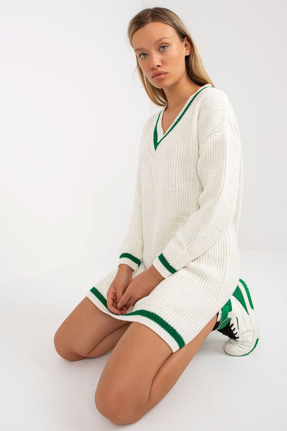 Elegant Rue Paris Knit Dress with Long Sleeves and Heart Neckline - Perfect for Any Occasion, displayed elegantly as a model kneels, highlighting the chic design with sporty sneakers.