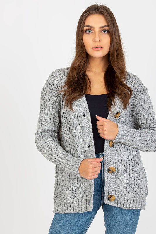 Elegant Women's Heart Neckline Cardigan in 100% Acrylic by Rue Paris, featuring a stylish grey knitted design with long sleeves and a sophisticated button closure, paired with casual denim for a chic look.