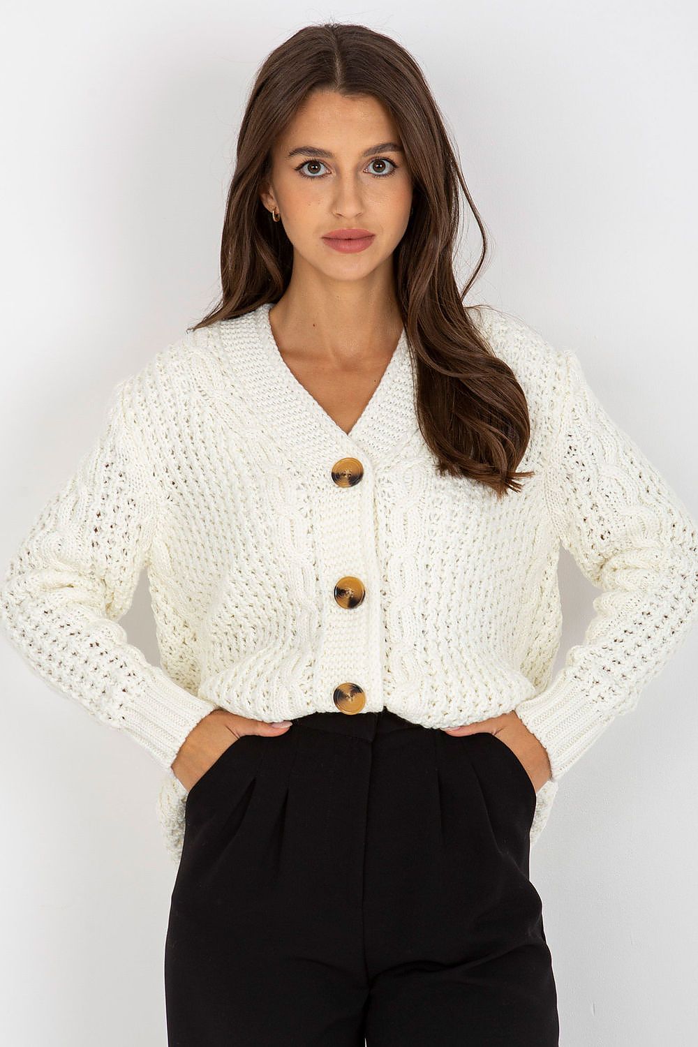 Elegant Women's Heart Neckline Cardigan in 100% Acrylic by Rue Paris, featuring long sleeves and button closure, model poses elegantly with a chic outfit.