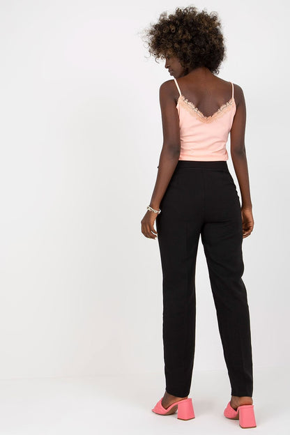 Back view of a model wearing Women's High-Waisted Straight Leg Trousers with Slip Pockets by Xsapienza, paired with a delicate pink top and stylish pink heels, showcasing a chic and elegant silhouette.