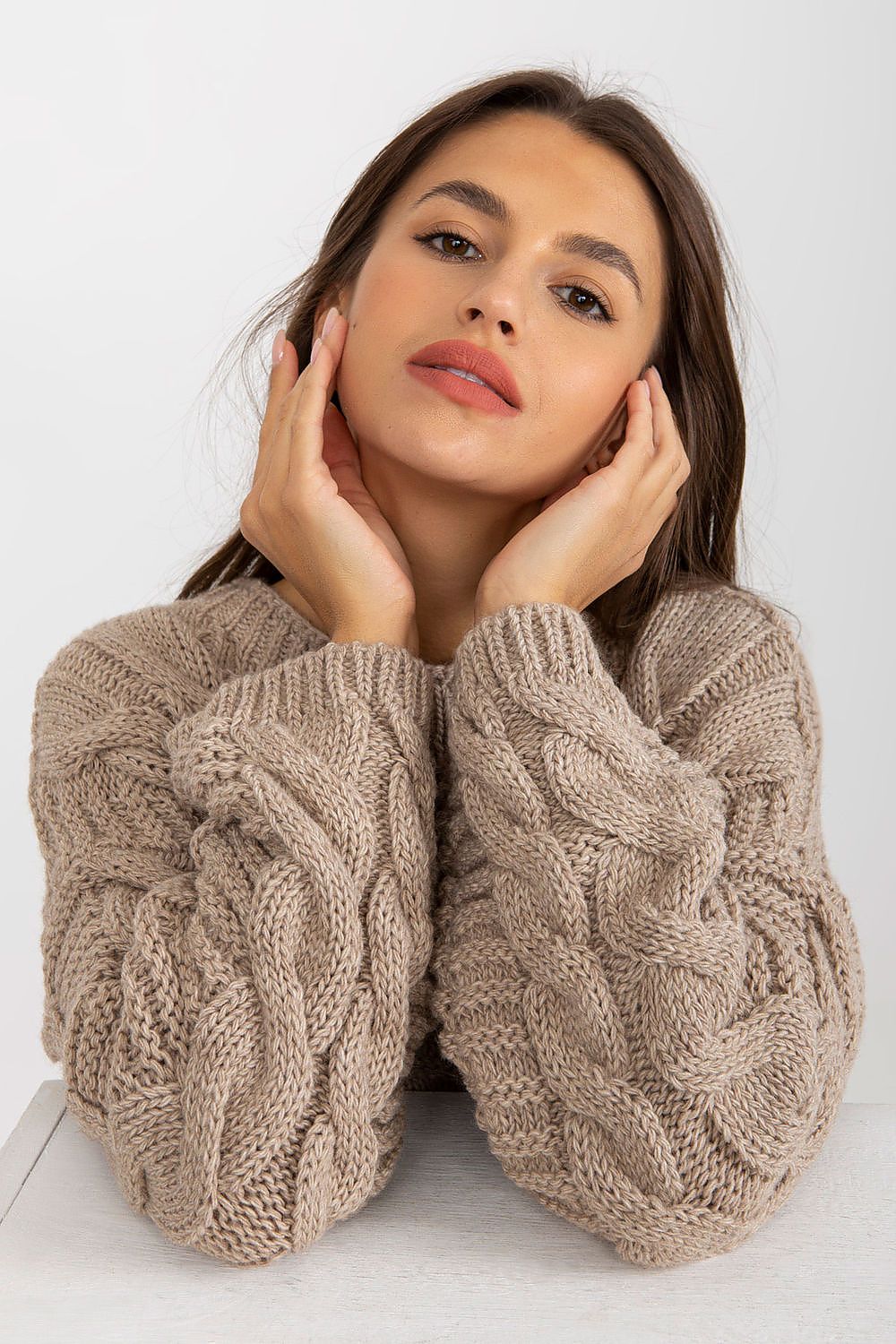 Close-up of the Extended Cut Women's Jumper With Wide Long Sleeves - 70% Acrylic 30% Wool by Rue Paris, highlighting the exquisite cable knit design and luxurious fabric for a chic, sophisticated look.