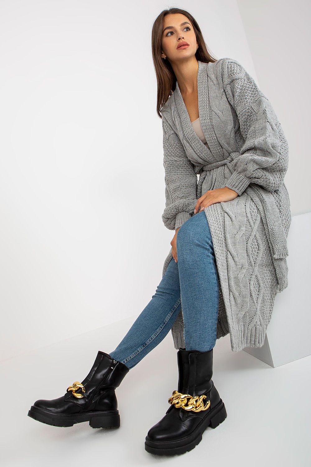 Luxury Long Sleeve Cardigan with Tie Belt by Rue Paris, displayed in grey, featuring a chic wrap style paired with denim, exuding sophistication and comfort.
