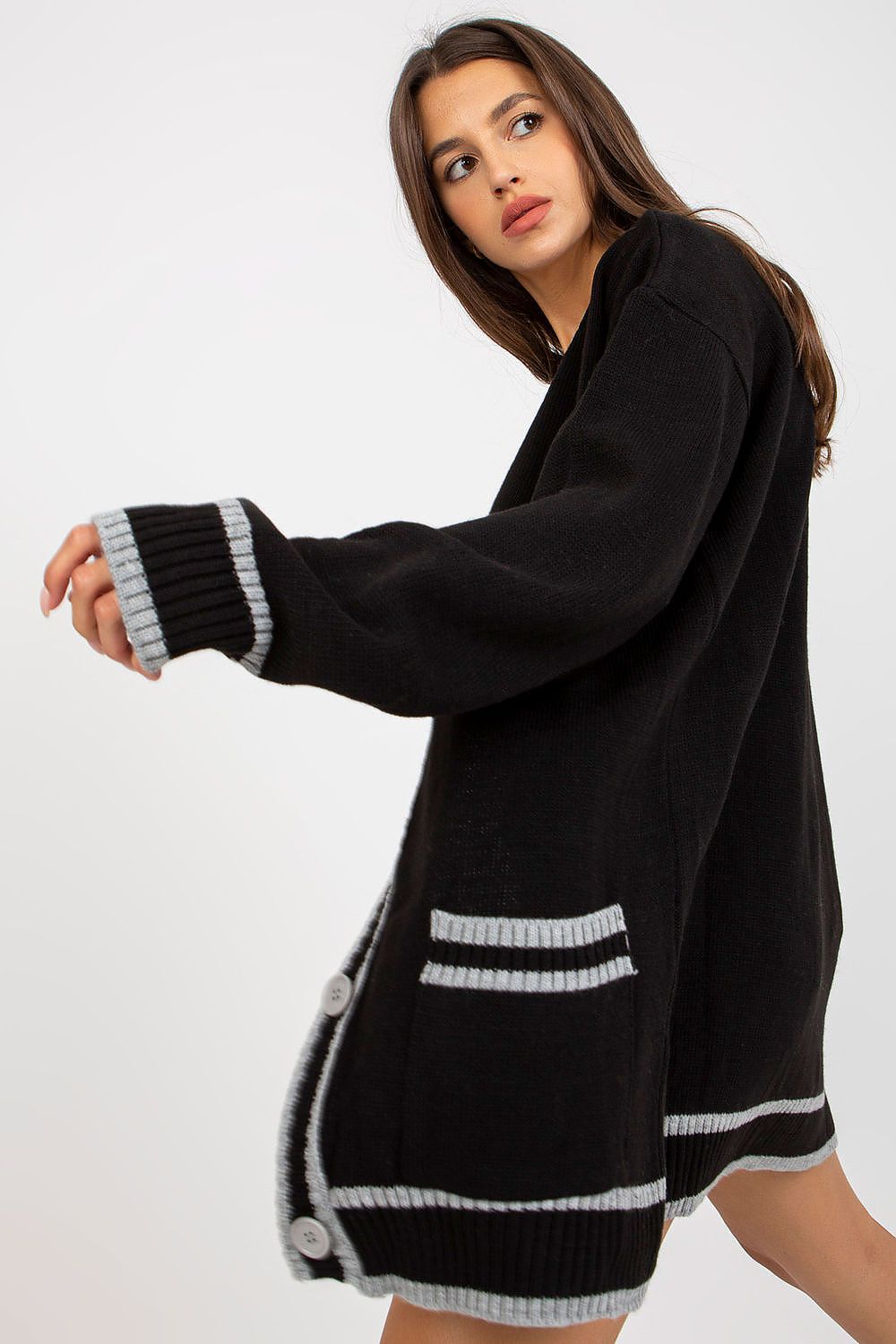 Luxury Long-Sleeved Acrylic Cardigan With Button Closure And Contrast Trim by Rue Paris, shown in black, designed with contrast detail and complemented by a dynamic pose for a modern look.