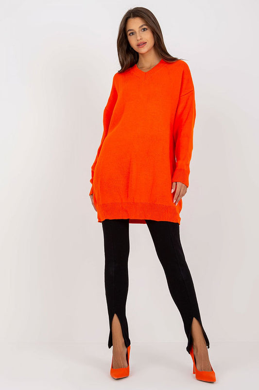 Luxurious Rue Paris Women's Sweater with Extended Cut, Long Sleeves and Heart Neckline in vibrant orange, styled with black leggings and orange heels.