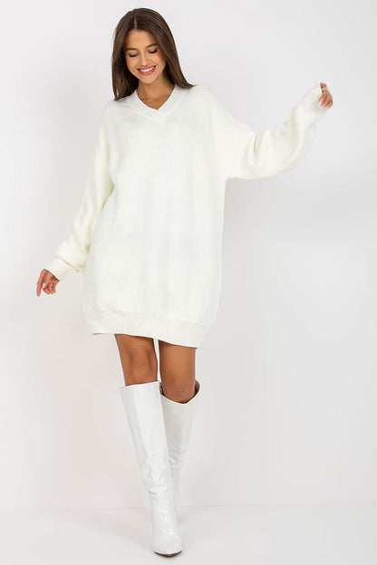 Luxurious Rue Paris Women's Sweater with Extended Cut, Long Sleeves and Heart Neckline in chic white, elegantly paired with stylish white boots.