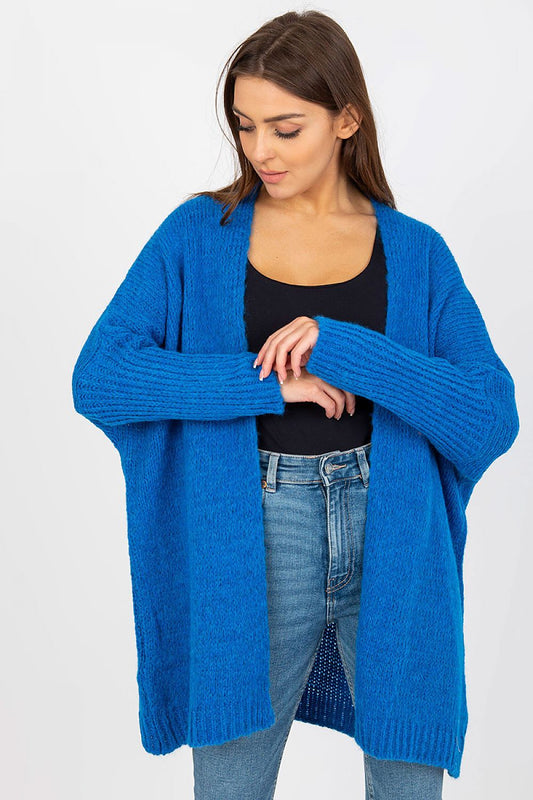 Model displaying the Och Bella Unbuttoned Cardigan with Long Wide Sleeves and Contrasting Lettering in vibrant blue, highlighting its relaxed fit and luxurious texture.