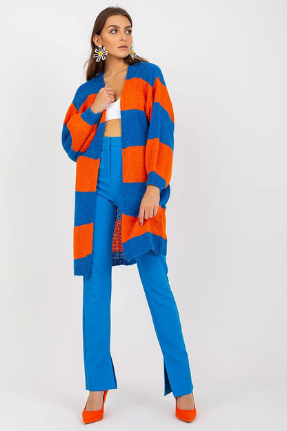 Och Bella Long Sleeve Cardigan with Colourful Stripes - Stylish, Loose Fit, EU Size 0. Model presenting a fashion-forward look featuring the vibrant striped cardigan, perfectly styled with contrasting trousers.