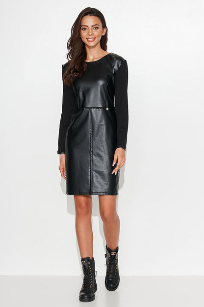 Luxurious Numinou black short dress featuring a stylish leather front and comfortable knitted back, designed for elegance and comfort, available in sizes EU 36 to 42.