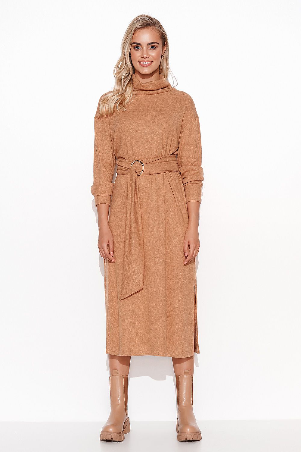 Elegant Long Fitted Ribbed Knit Dress With Turtleneck & Slit by Makadamia, featuring a stylish camel hue, designed with a flattering fitted silhouette, long sleeves, and a chic belt showcasing a round buckle.