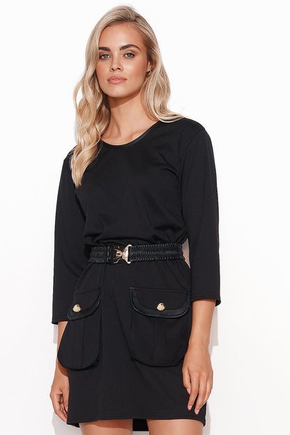 Stunning Black Knitted Mini Dress by Makadamia featuring elegant leather trim and gold accents, perfect for stylish casual or work wear. Model showcases the dress with a belt for added definition.