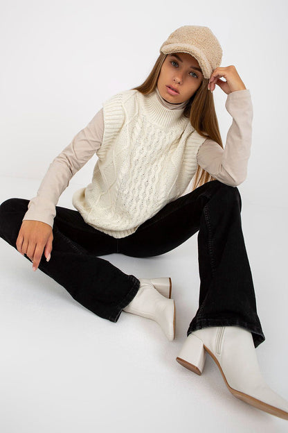 Luxurious Plaid Sleeveless Knitted Gilet Jacket by Sublevel styled elegantly with a beige long-sleeve top, complemented by a chic cap and fashionable footwear. Ideal for various occasions.