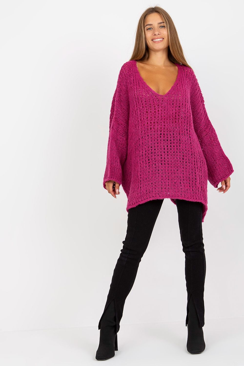 Luxury Women's Loose Fit Sweater With Heart Neckline & Asymmetrical Hem By Och Bella in a rich pink hue, elegantly styled with black trousers, exuding comfort and modern luxury.