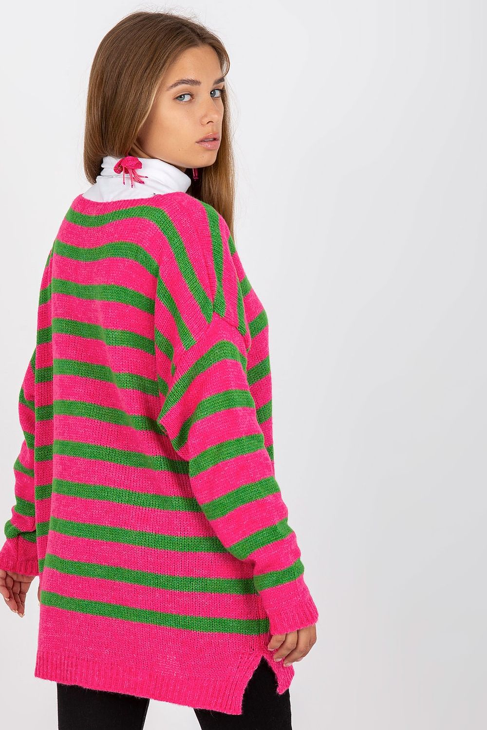 Back view of the Och Bella Women's Colourful Striped Sweater with Long Sleeves and V-Neck Design, highlighting the vibrant colours and relaxed fit on a model with elegant earrings.