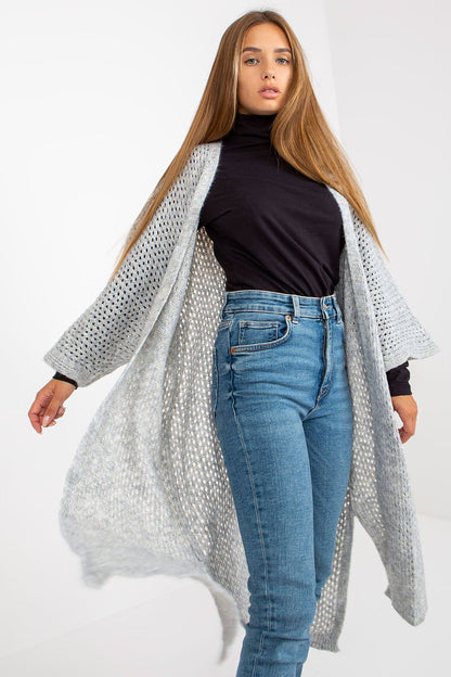 Sophisticated look at the Elegant Openwork Long Sleeve Cardigan by Och Bella in light grey, showcasing its elegance while draping beautifully around the model.