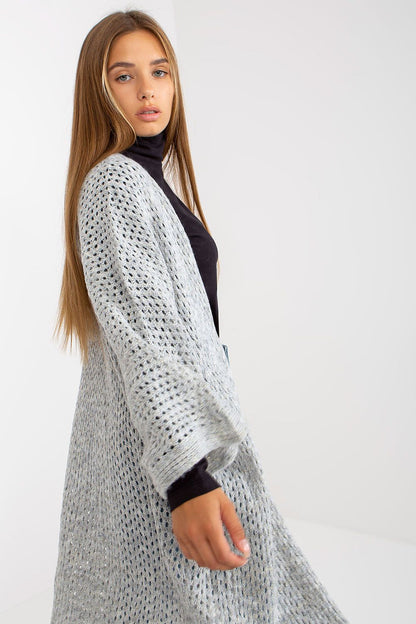 Stylish presentation of the Elegant Openwork Long Sleeve Cardigan by Och Bella in grey, focusing on the intricate knitting pattern and luxurious fit.