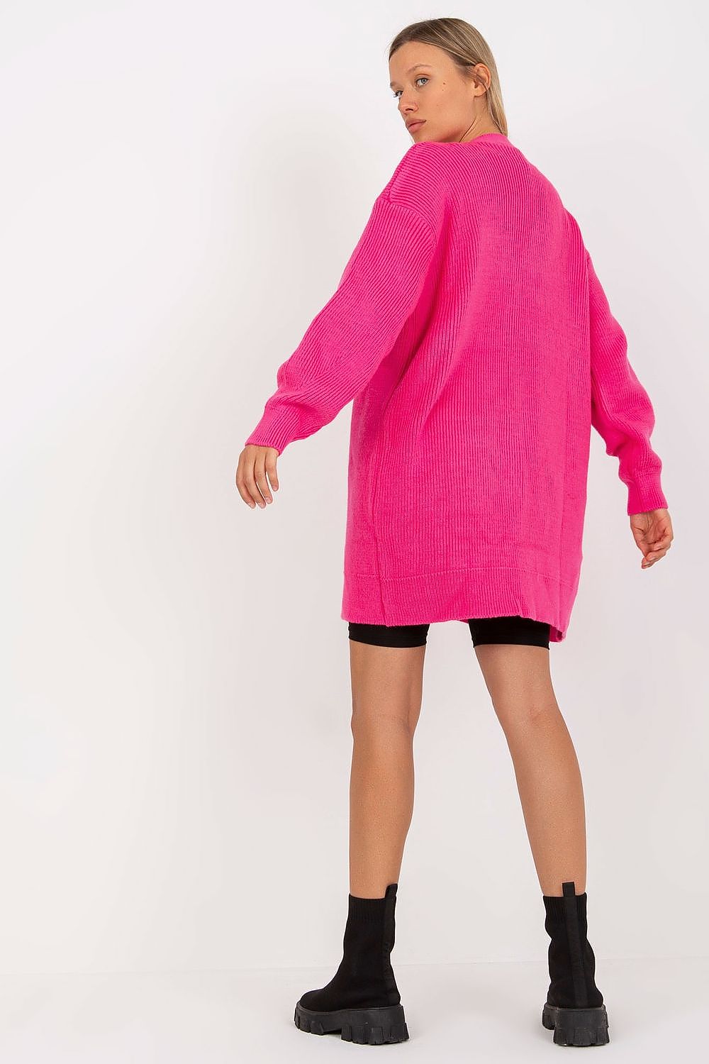 Back view of the Elegant Extended Cut Cardigan by Rue Paris in vibrant pink, featuring a chic extended cut, button closure, and long sleeves, ideal for a fashionable, luxurious look.