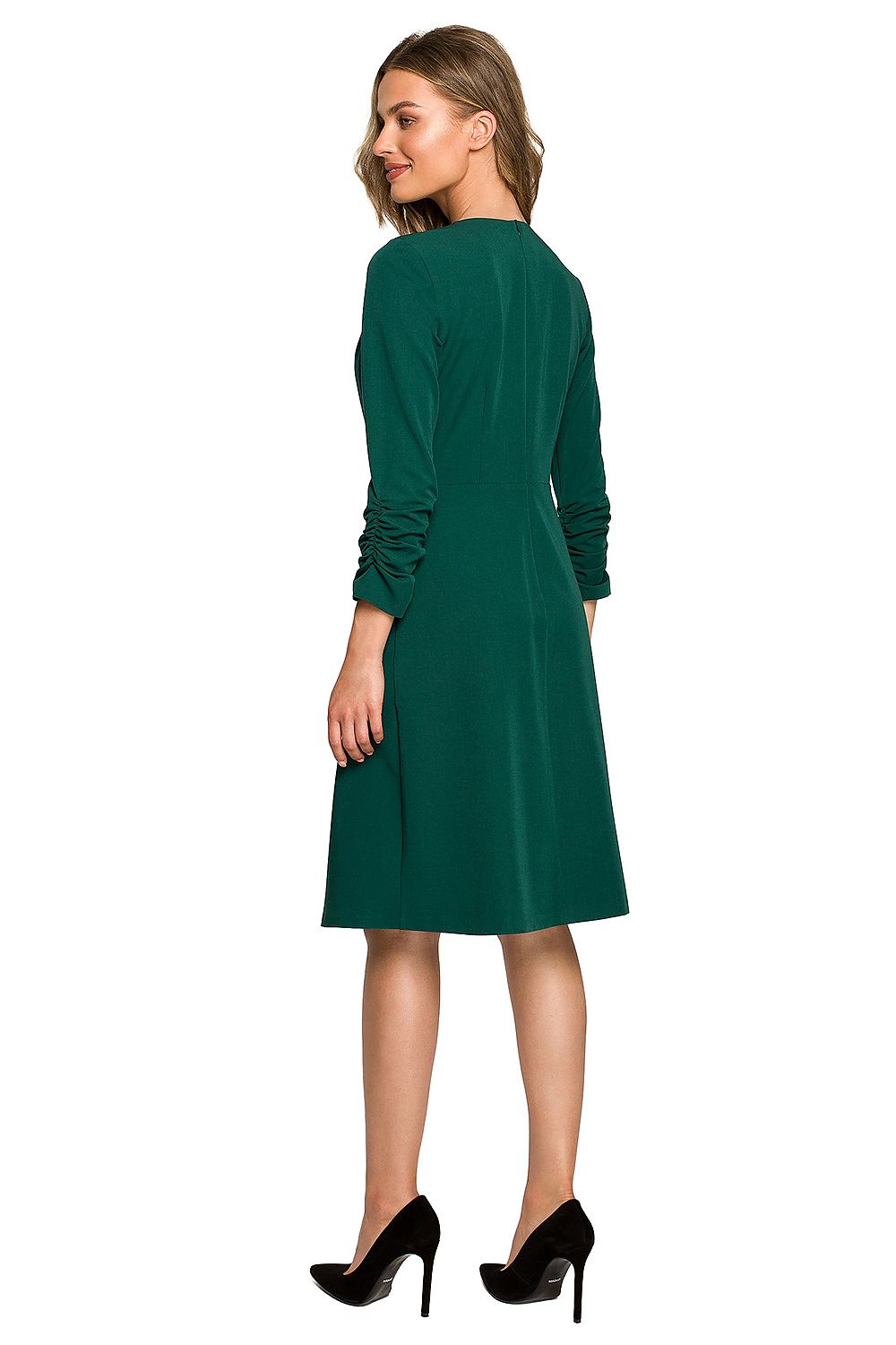 Elegant green daydress with ruffled sleeves and flared bottom showcased on a model, epitomising grace and sophistication.