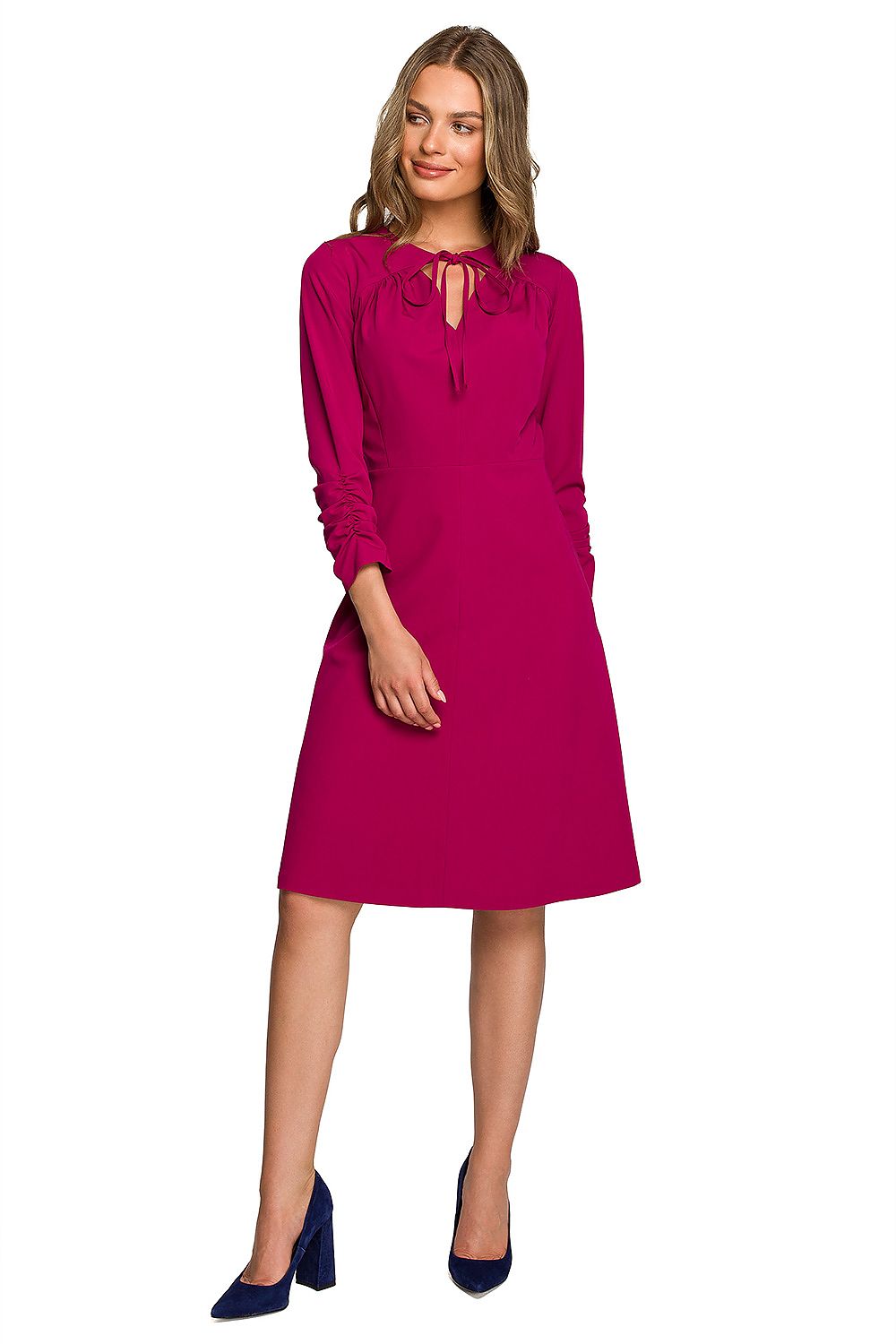 Chic fuchsia daydress featuring a tie-neck detail, elegantly worn by a model accentuating a refined style.