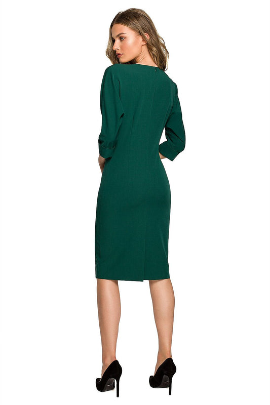 Stylove elegant daydress showcasing the back view with feminine detailing and batwing sleeves in luxurious green fabric, perfect for stylish women.