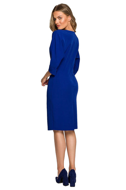 Back view of a luxurious women's daydress in royal blue, featuring sophisticated batwing sleeves and a fitted silhouette, ideal for fashionable outings.