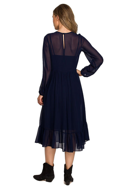 Back view of a fashionable navy chiffon cocktail dress featuring a ruffled hem and wide elastic sleeves, showcasing elegance and sophistication.