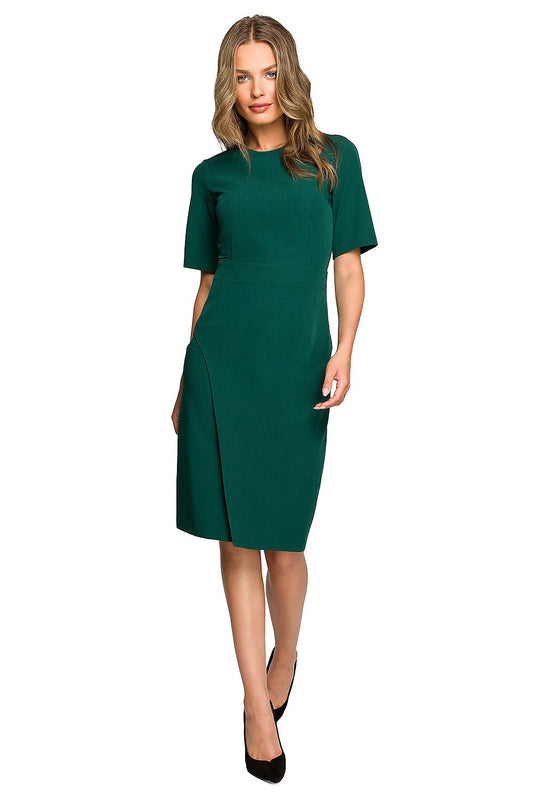 Stylish green pencil dress by Stylove featuring a double overlap front and short sleeves, elegantly worn by a model.