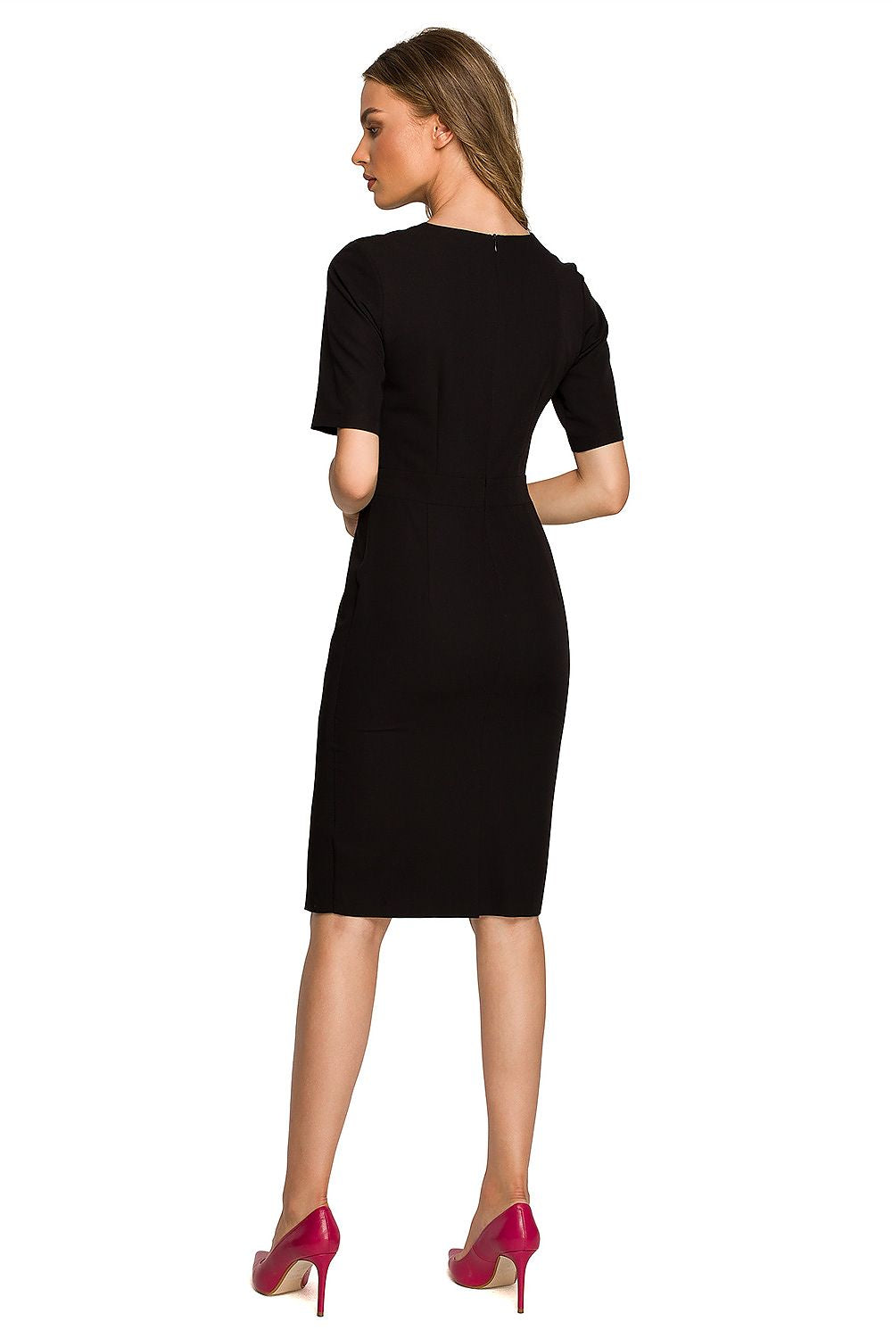 Elegant black dress worn by a model from the back, featuring a discreet zipper closure, accentuating the tailored fit for a polished appearance.