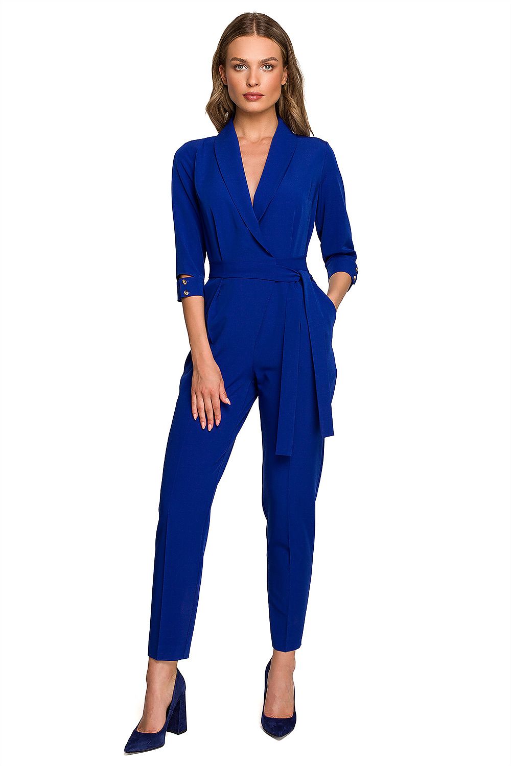 Stylove vibrant blue jumpsuit with an envelope neckline, waist tie, and 7/8 length sleeves, elegantly posed from the front, ideal for sophisticated outings.