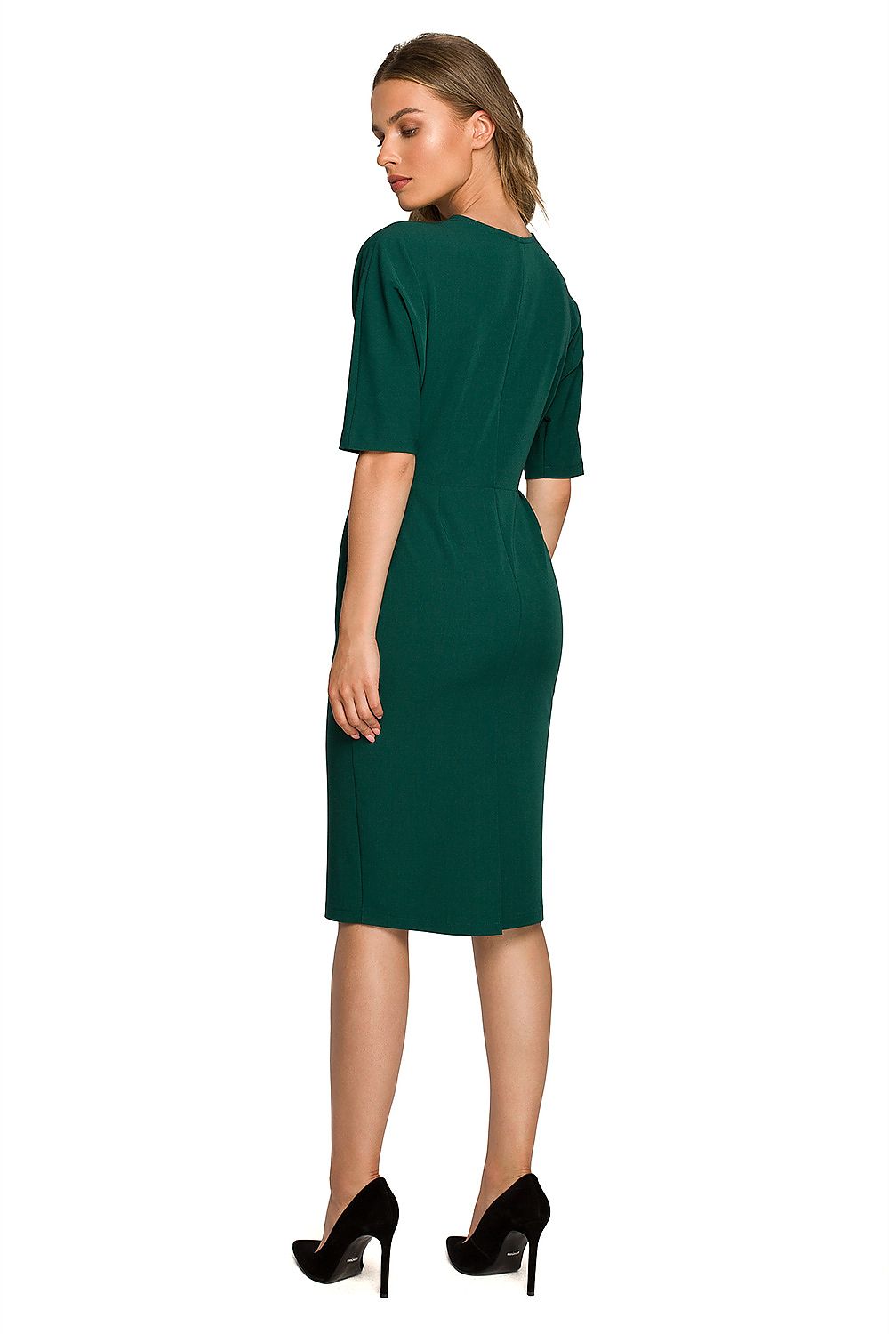 Back view of a sophisticated green envelope top daydress with batwing sleeves, showcasing its immaculate tailoring and chic pencil silhouette.