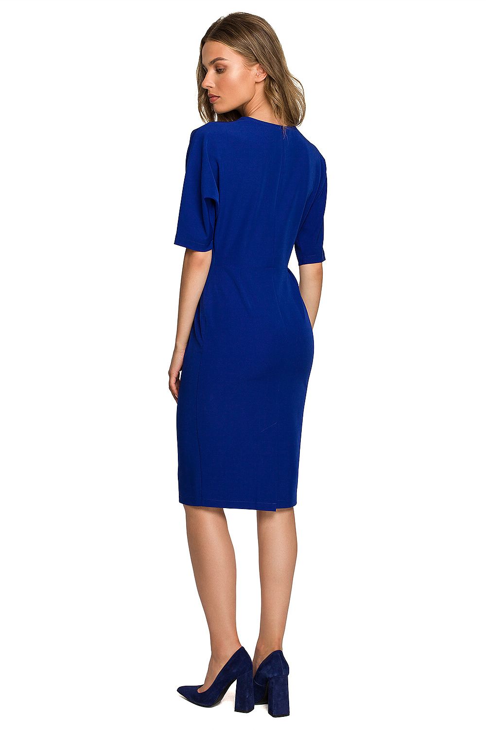 Elegant blue batwing sleeve daydress with an envelope top and pencil bottom, showcasing a sleek back view complemented by high-heeled navy shoes.