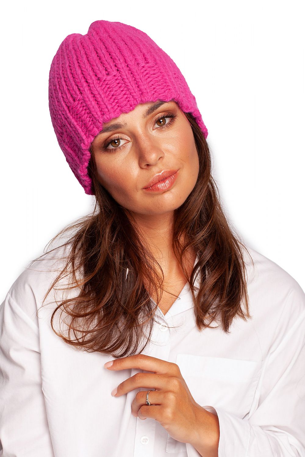 Luxury pink thick-weave beanie cap styled elegantly, featuring a ribbed brim, perfect for winter fashion.