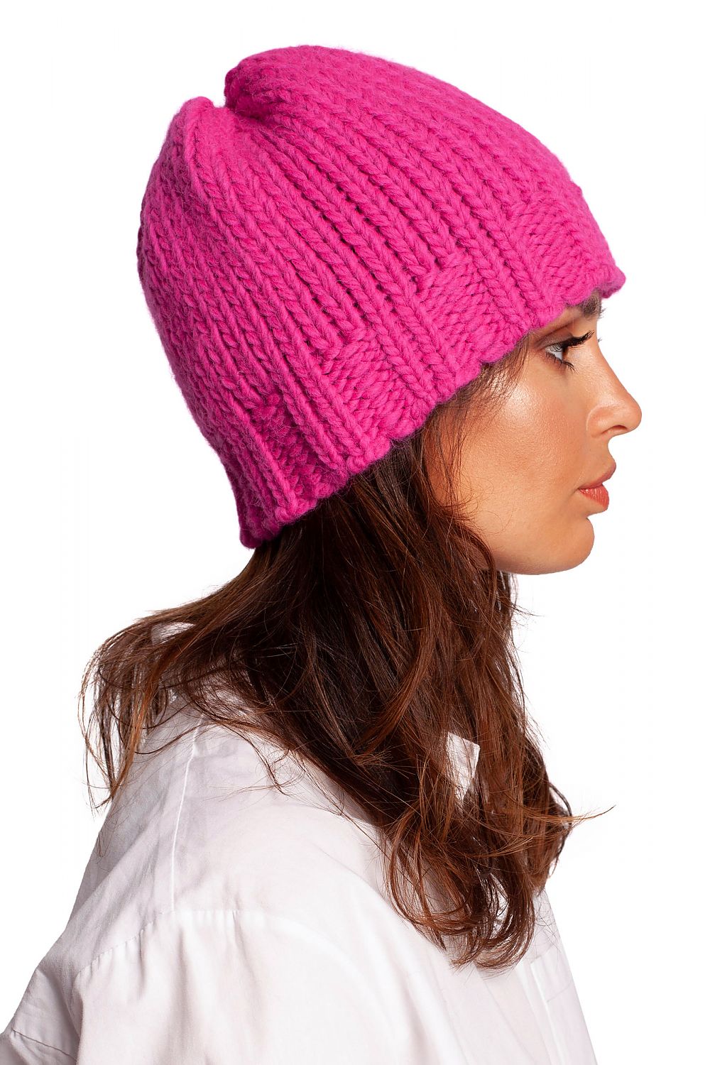 Side view of a luxurious pink thick-weave beanie cap, showcasing its ribbed design and chic style.