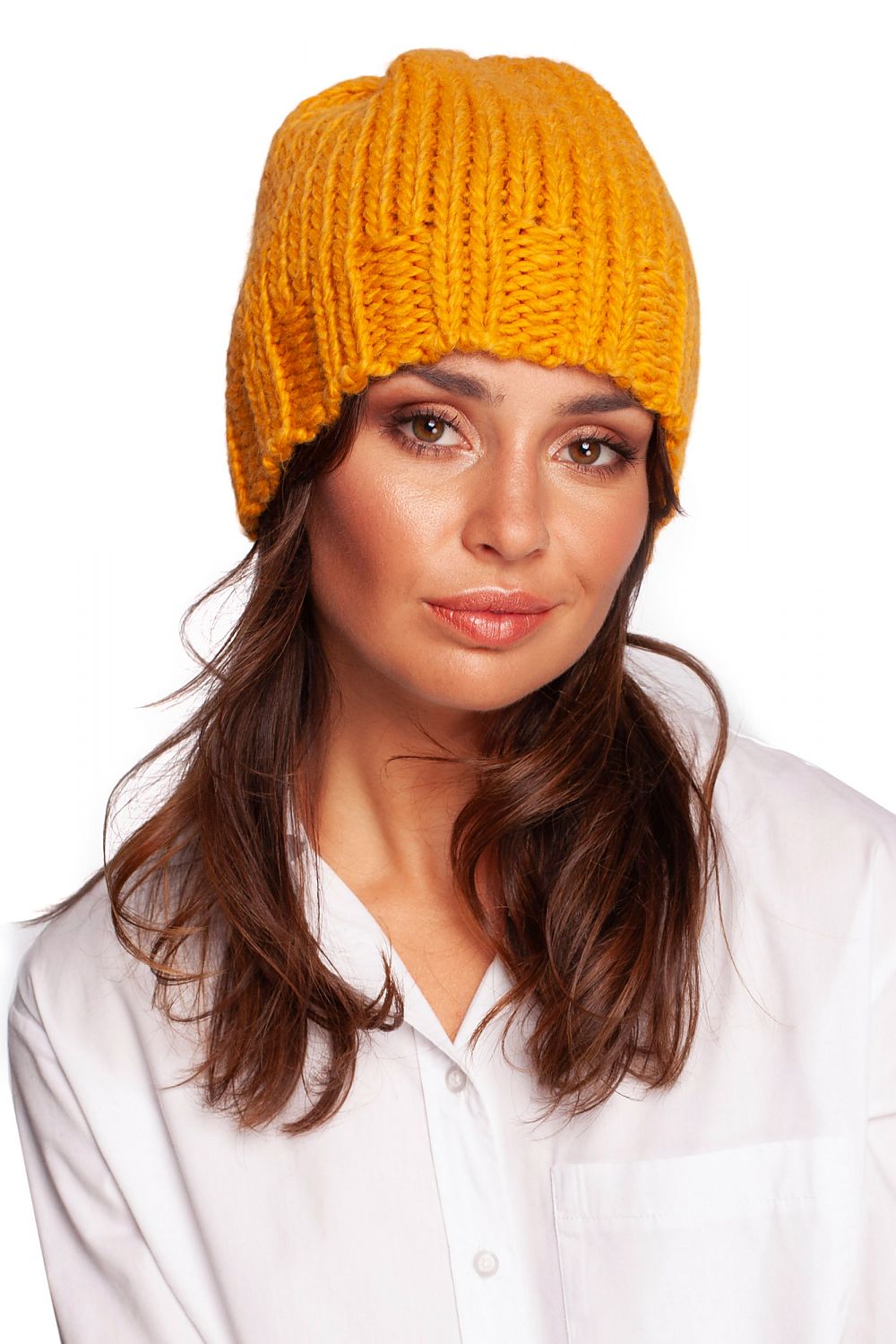 Luxury warm thick-weave beanie cap in vibrant yellow, featuring a stylish ribbed brim, modelled elegantly against a white backdrop.