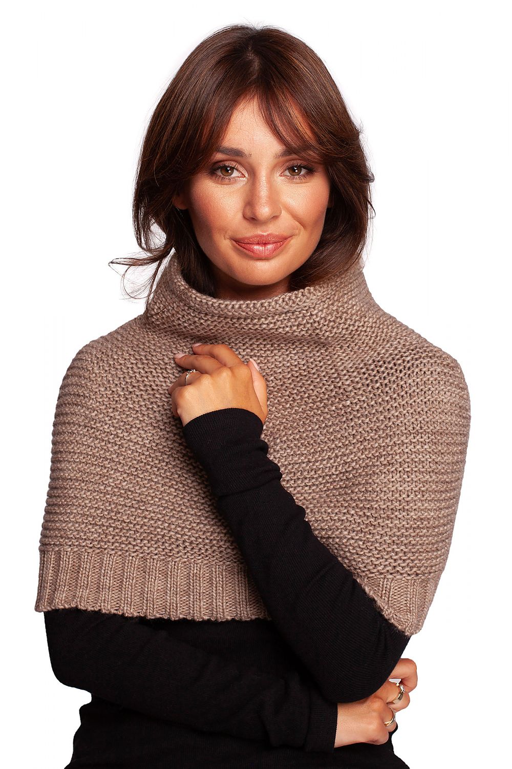 A stylish woman showcasing the luxurious 3-way infinity scarf by BE Knit, elegantly wrapped around her neck. The scarf features a warm, soft knit fabric in a sophisticated taupe colour, complementing her chic outfit while providing both style and comfort.