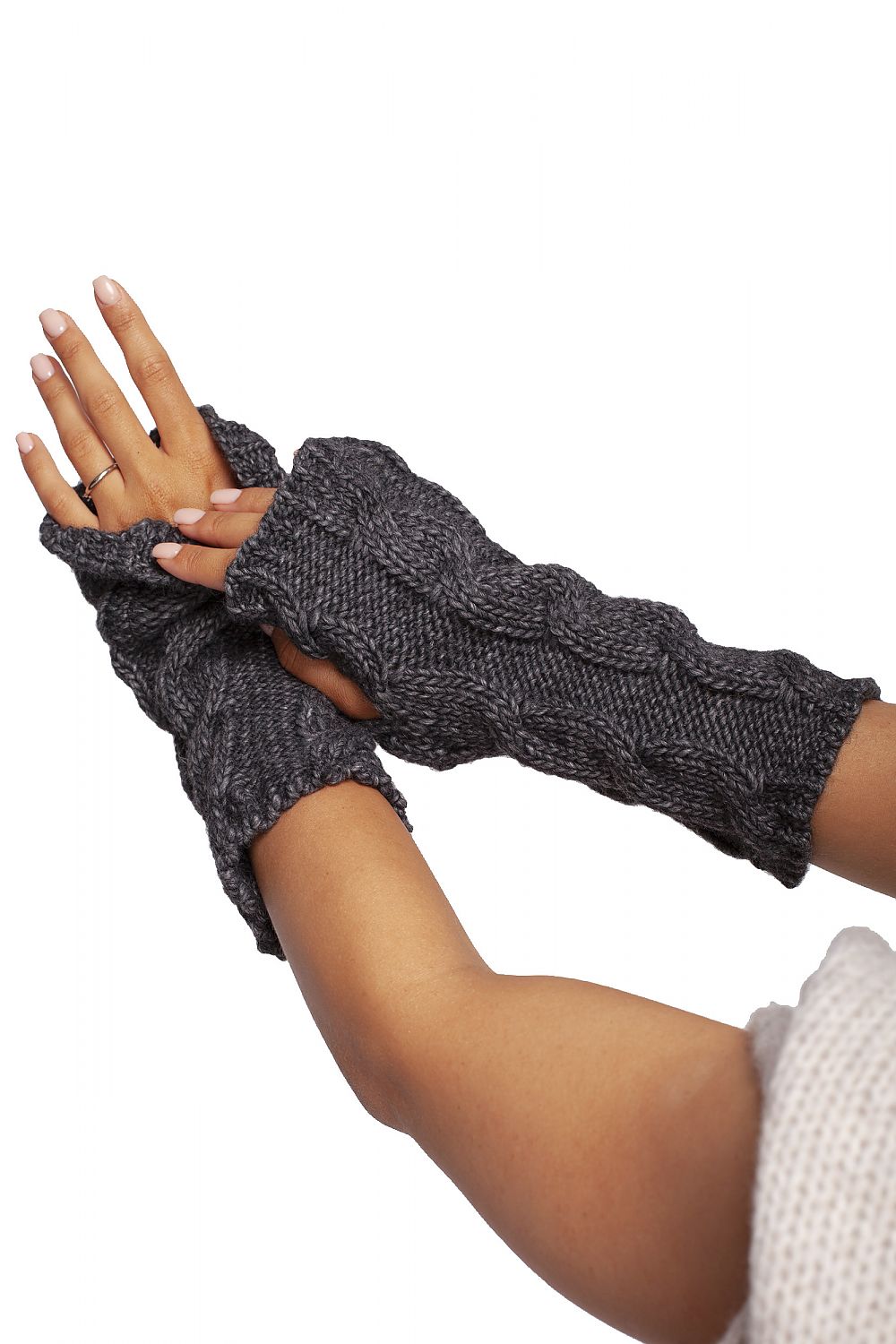 Detailed shot of grey ribbed fingerless gloves, showcasing the luxurious knit pattern in a stylish arrangement.