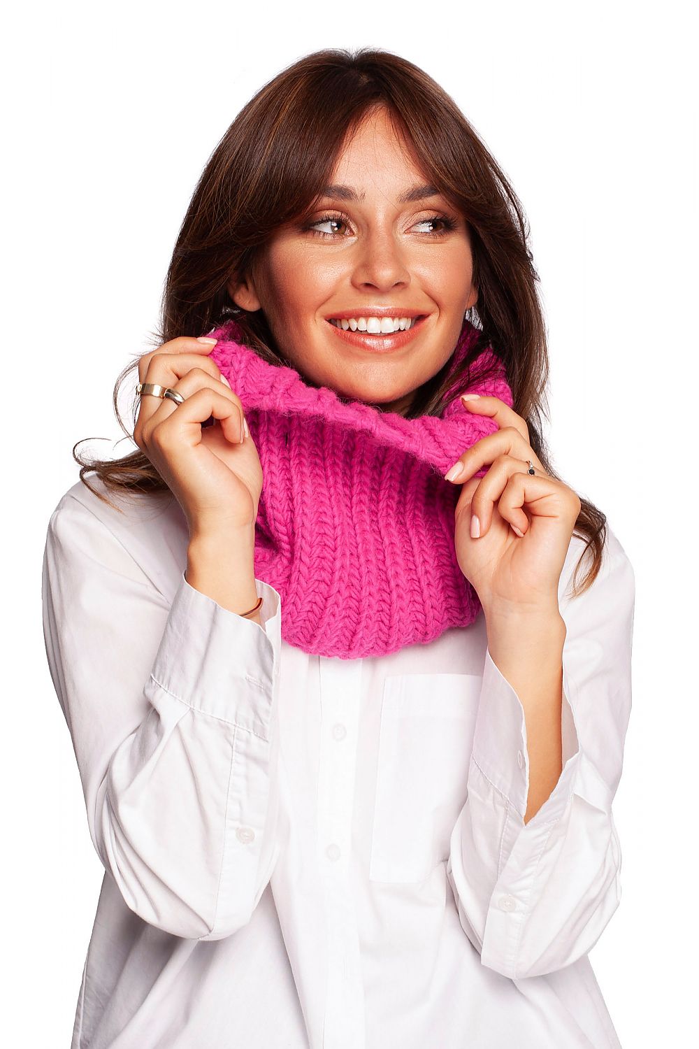Chic model showcasing a vibrant pink infinity scarf, embodying cozy luxury for cold weather fashion.