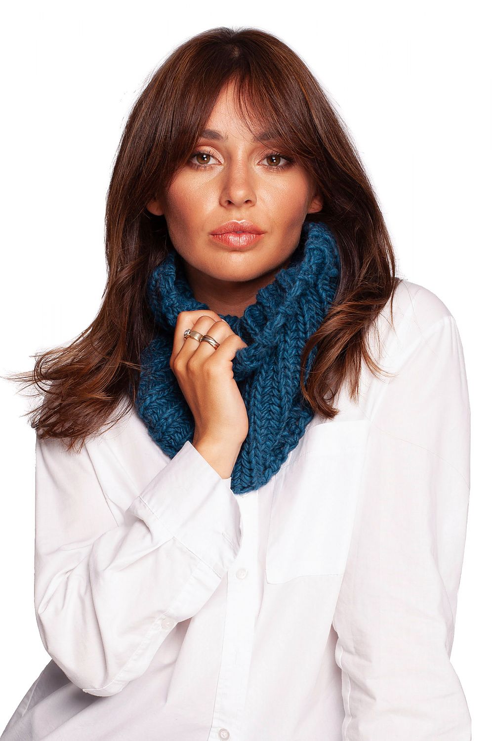 Elegant model wearing a deep teal infinity scarf, demonstrating a timeless style for winter comfort.