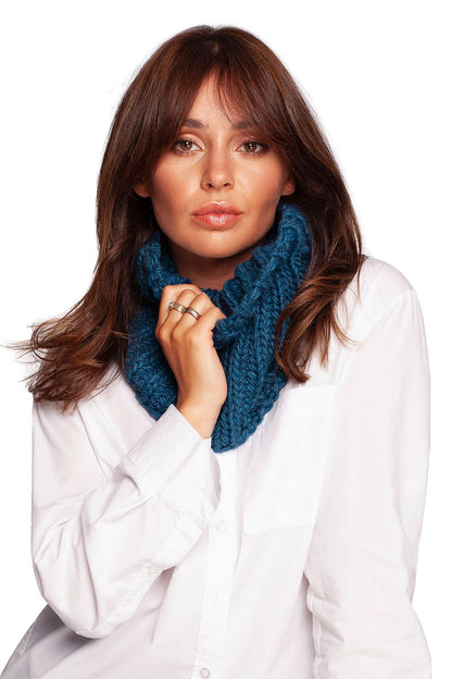 Elegant model wearing a deep teal infinity scarf, demonstrating a timeless style for winter comfort.