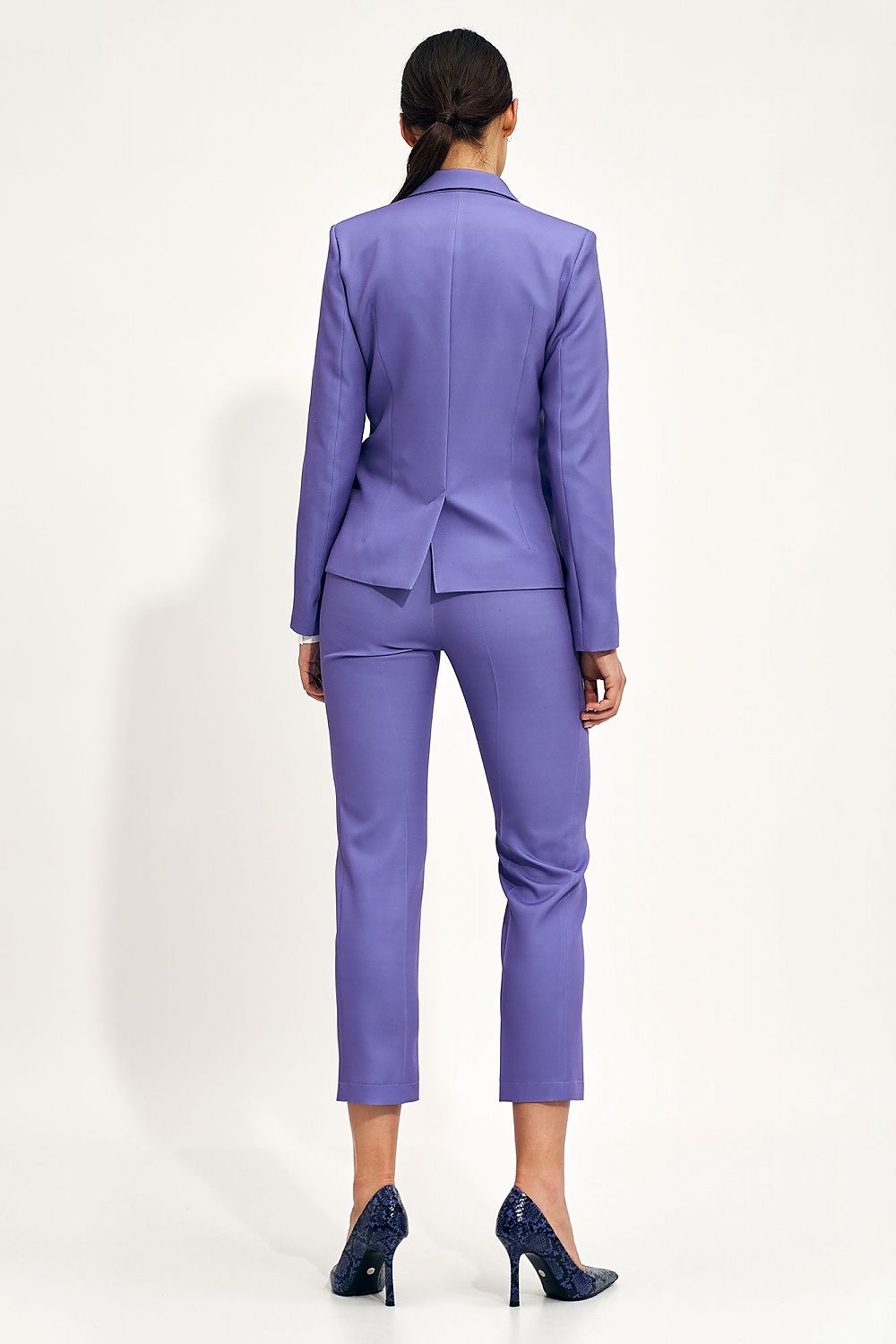 Back view of the Nife Women’s Classic Blazer Jacket in rich purple, paired with matching tailored trousers, highlighting a polished silhouette for modern professional attire.