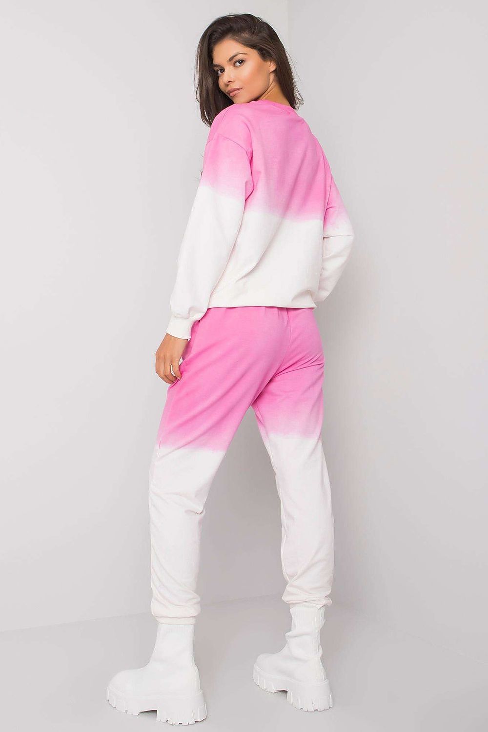 Sophisticated back view of a fashionable women's lounge set in pink and white, designed for ultimate comfort and style.