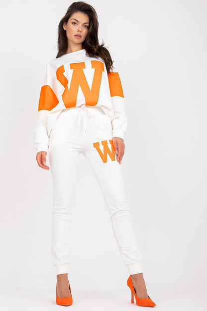 Elegant women's casual wear, highlighting a loose sweatshirt adorned with a prominent 'W' design, paired with tailored white pants and orange heels, exuding sophistication and comfort.