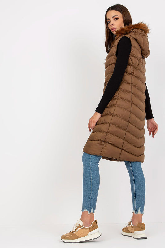 Sophisticated view of the Luxury Rue Paris Down Long Zippered Vest, highlighting its plush texture and functional design with a detachable hood, set against a minimalist backdrop.