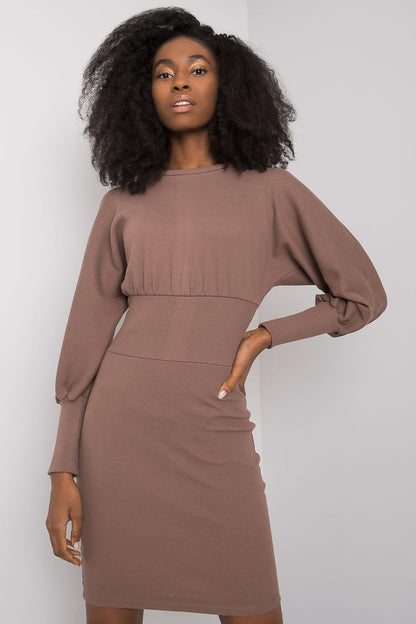 Chic brown fitted daydress by Rue Paris with long sleeves, showcased elegantly by a model with voluminous curls.