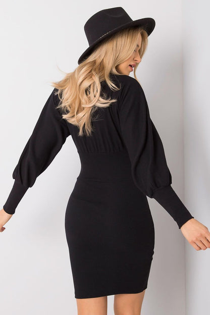 Back view of the Rue Paris daydress in black, highlighting the exquisite fitted style and sophisticated long sleeves, perfect for elegant gatherings.