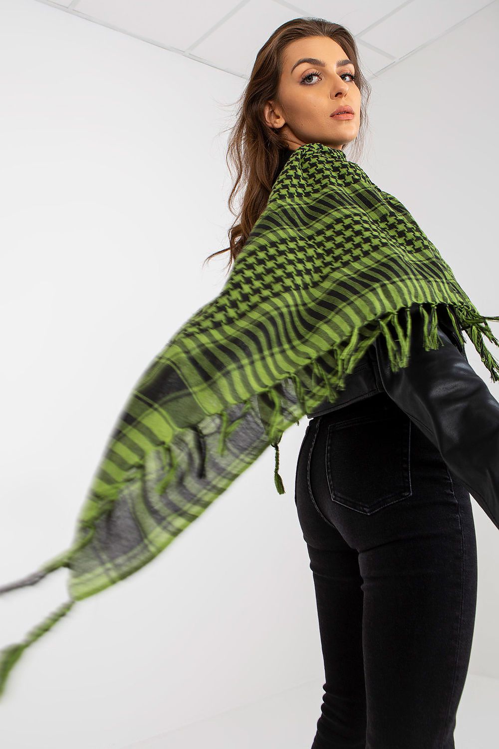 Elegant luxury checkered neckerchief scarf in vibrant green, styled draped over a model's shoulders, showcasing its versatile design in a minimalist setting.