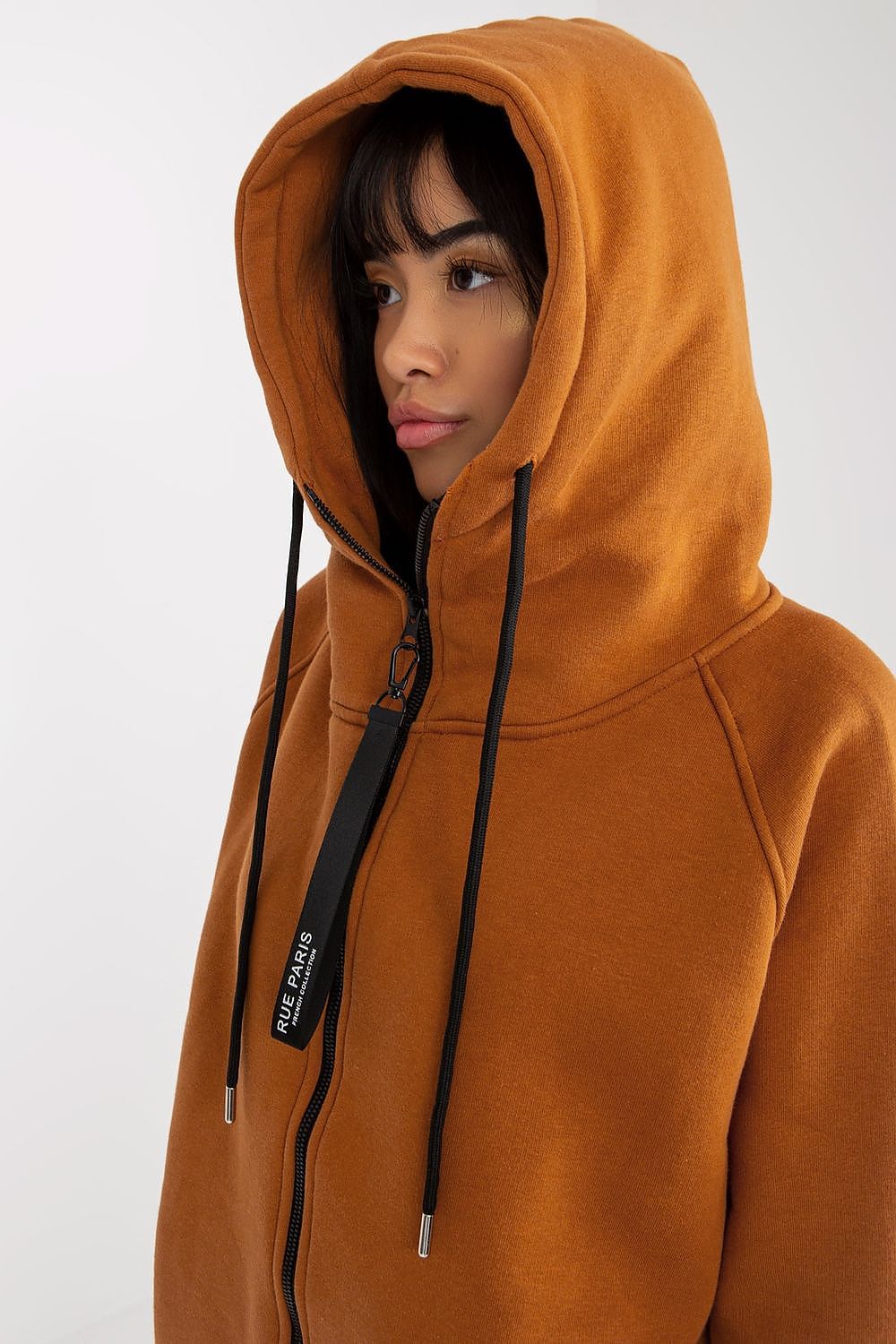 Close-up of a luxurious women's zippered hoodie sweatshirt in deep brown by Rue Paris, highlighting the sophisticated hood and high-fashion details.